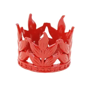 Mini red metal crown cake topper with intricate leaf design and pearl bead base decor
