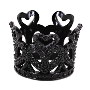 Detailed view of mini black alloy cake crown with heart patterns and beaded textures