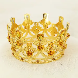 Golden round birthday cake crown ornament with amber rhinestones and floral details