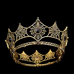 Close-up of vintage Gothic spider web crown with black gemstone in antique gold finish