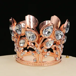 Macro view of rose gold birthday crown with sparkling teardrop crystals and floral hollow design