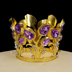 Macro detail of golden crown cake topper with purple crystal water drops and white diamonds