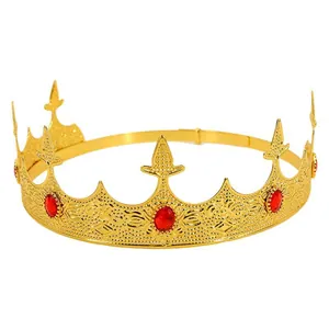 Golden royal crown with red gemstones and intricate cutout patterns for palace parties