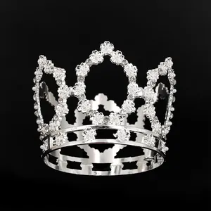 Exquisite silver flower alloy crown with white pearls and rhinestones on black background