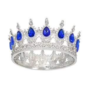 Detailed macro of vintage silver bridal crown with nine blue teardrop crystals and rhinestones