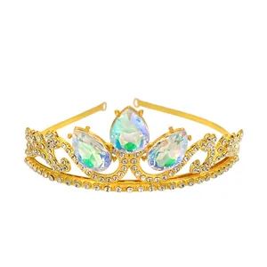 Detailed macro view of golden rhinestone tiara with colorful teardrop gemstones