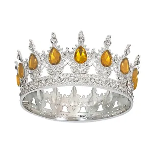 Macro detail of silver bridal crown with amber teardrop gems and sparkling rhinestones