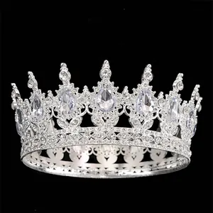 Close-up of silver crown with teardrop crystals and heart-shaped hollow metalwork