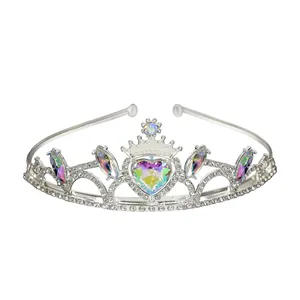 Detail of silver crown showing center heart-shaped iridescent gem and clear rhinestones