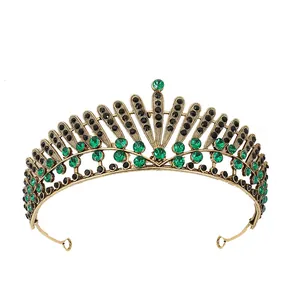 Vintage gold bridal crown featuring green and black rhinestones on a white background