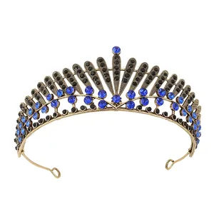 Vintage gold bridal crown with blue and black crystals in a gothic tiara design