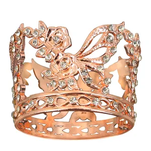 Rose gold crown with flower hollow design and sparkling rhinestones on white background