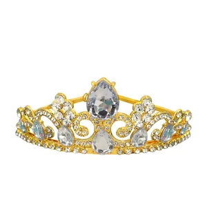 Macro detail of golden princess crown featuring teardrop rhinestones and metallic luster
