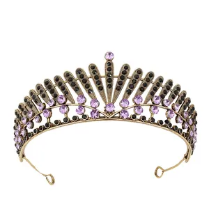 Detailed close-up of vintage bronze crown with purple and black rhinestones