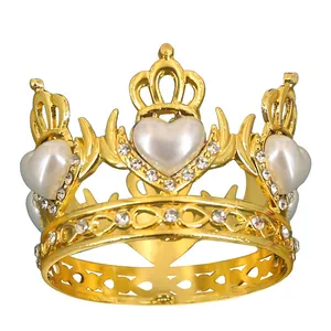 Macro detail of golden tiara crown featuring white heart pearls and sparkling rhinestones