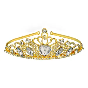 Macro shot of gold bridal crown featuring large heart-shaped crystal and marquise rhinestones