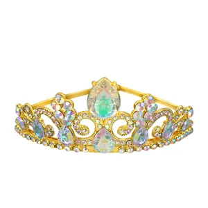 Close-up of golden princess crown with colorful rhinestones and teardrop jewels