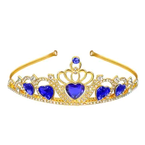 Detailed view of a golden crown featuring blue heart crystals and sparkling rhinestones