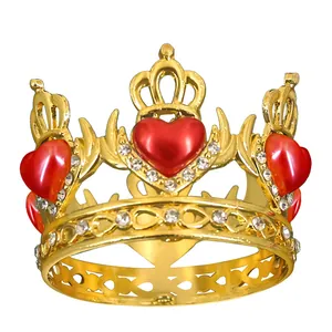 Detailed close-up of golden alloy crown with red hearts and white rhinestones decoration
