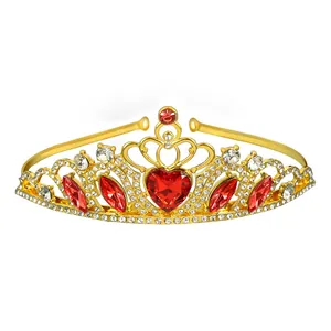 Detail of gold tiara with large red heart crystal and shimmering pavé rhinestones