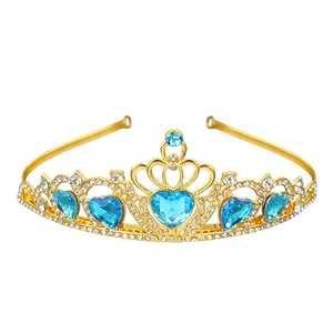 Close-up of golden princess tiara with blue heart gemstones and white rhinestones