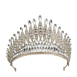 Macro shot of luxury gold tiara with sparkling crystal rhinestones for weddings