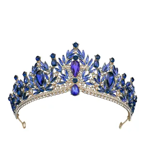 Detailed macro view of luxury baroque crown with blue teardrop crystals and gold finish