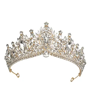 Detailed macro shot of baroque gold crown with sparkling rhinestones and crystal stones
