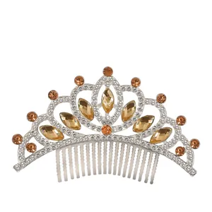 Macro detail of silver alloy crown comb with amber rhinestones for girls
