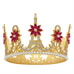 Close-up of golden bridal crown featuring Eiffel Tower motifs, pink crystals and pearls