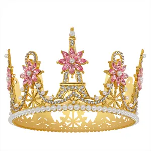Detail of golden bridal tiara with Eiffel Tower motif, pink gems and white pearls