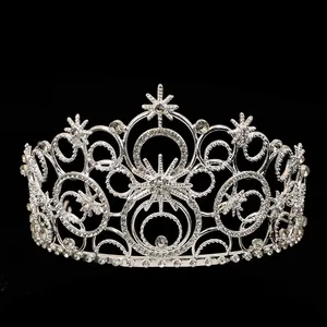 Elegant silver bridal crown with intricate hollow circles and sparkling starburst crystals