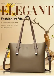 Détail du logo kangourou embossé sur le sac cabas en cuir marron avec anses robustes