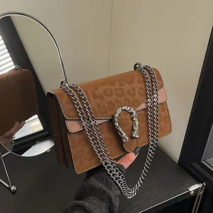 Vintage leopard print crossbody bag with silver horseshoe buckle and chain straps