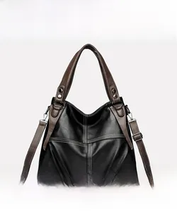 Front view of black and brown two-tone tote bag with contrast stitching and silver hardware