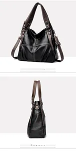 Macro shot of black pebbled leather tote with brown straps and white contrast stitching