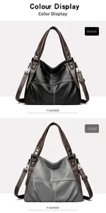 Detail of soft leather tote bags in black and gray with contrast stitching and metal lock