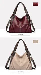 Detail view of large shoulder bags in wine red and khaki with contrast stitching