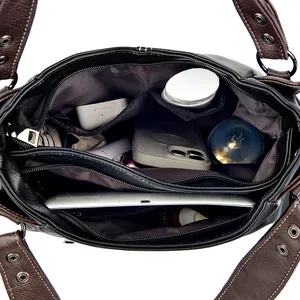Internal view of the tote bag showing multi-compartment storage and leather texture