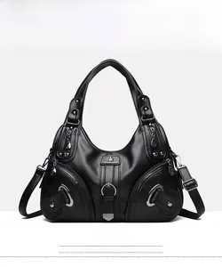 Detailed front view of a black lychee pattern faux leather handbag with zip accents