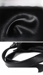 Detail showing high-quality lychee texture leather and durable handle of the black bag