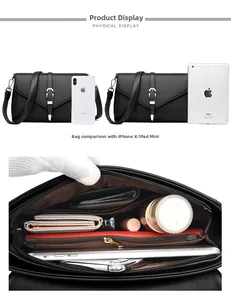 Internal compartments of black leather bag showing storage capacity with electronics
