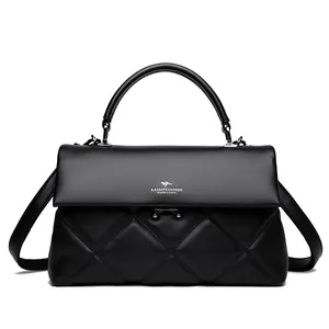 Classic black quilted leather handbag with silver logo and top handle in matte finish