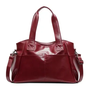 Dark red vintage handbag with large capacity and detachable strap on white background