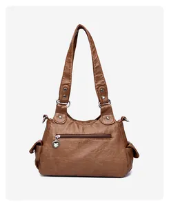 Detailed back view of brown PU leather handbag with zipper pocket and side pouches