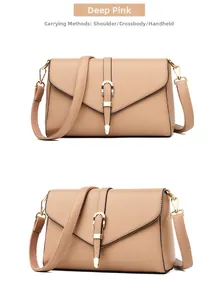 Detail view of deep pink cross-body bag with V-flap cover and golden horseshoe buckle