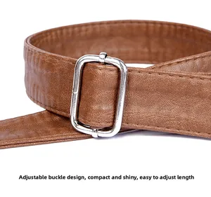 Close-up of adjustable silver metal buckle and brown textured PU leather shoulder strap