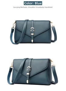Blue lychee grain PU leather crossbody bag with golden horseshoe buckle and strap detail