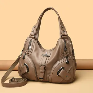 Hobo style khaki leather shoulder bag with multiple zip pockets and adjustable strap