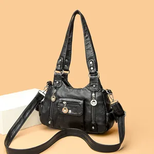 Black multi-pocket PU leather shoulder bag with silver studs and adjustable strap
